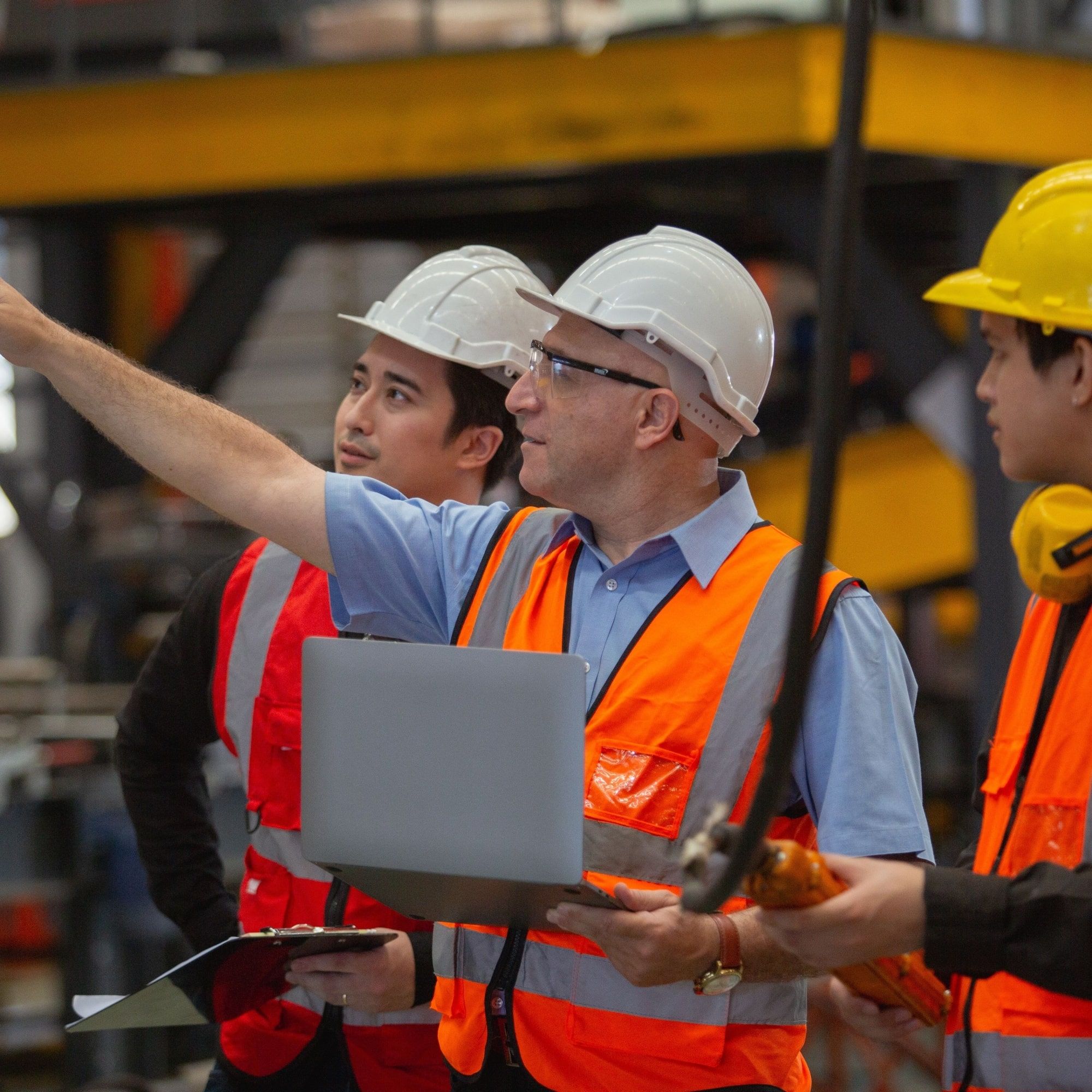 manager and employees inspecting and training in a building