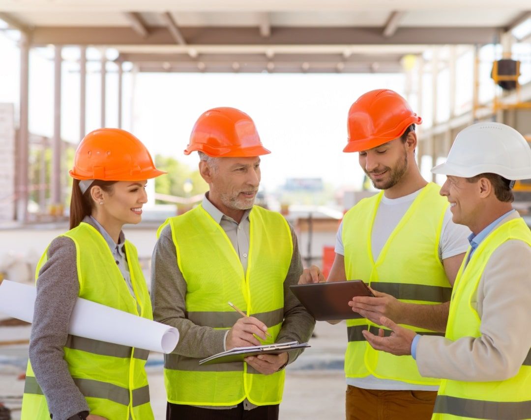 Group of workers discussing Ontario Safety Training