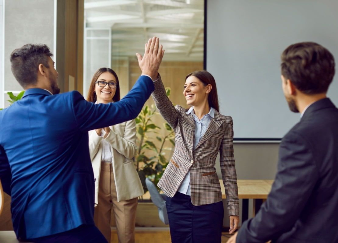 office colleagues doing high five